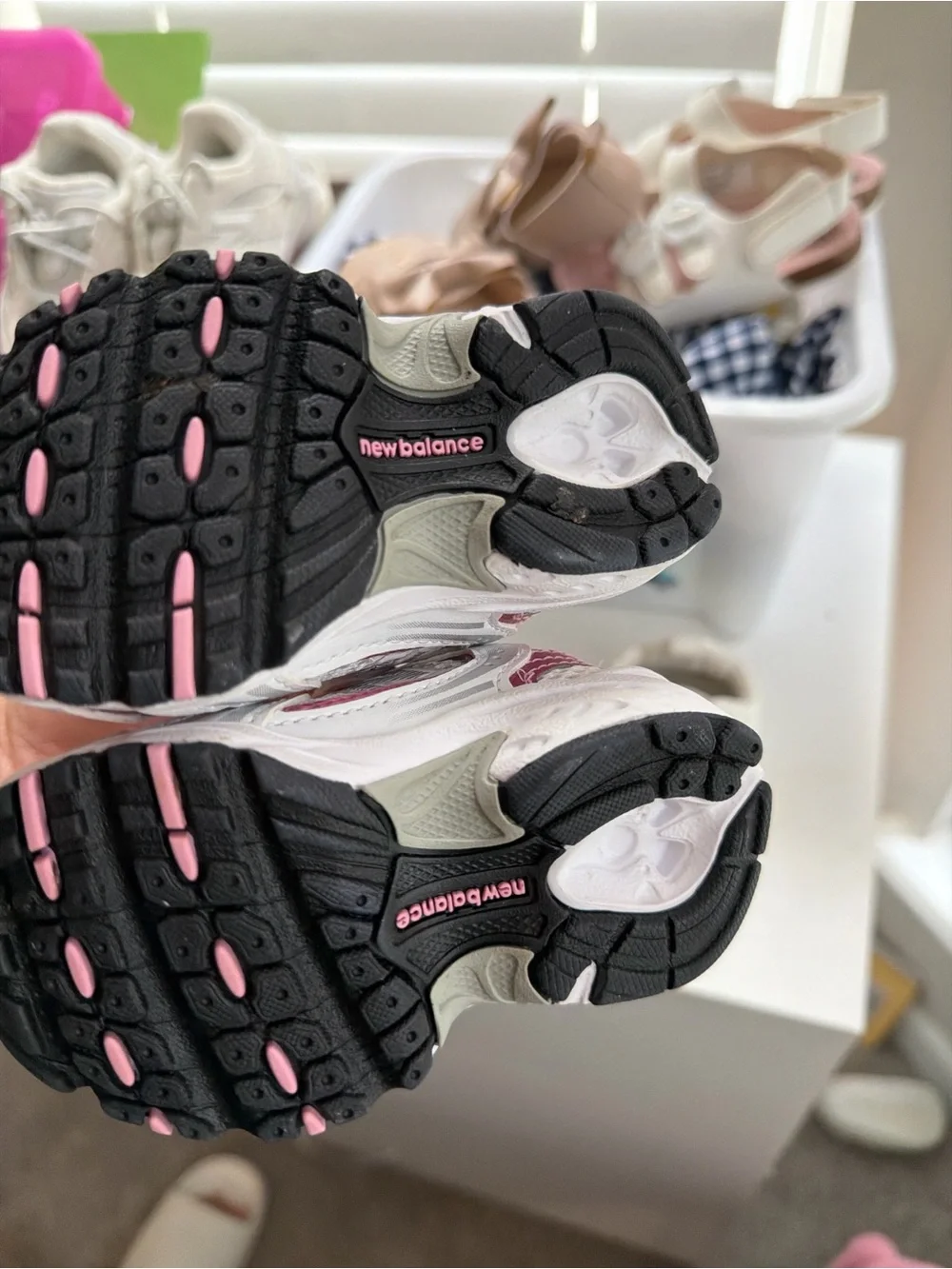 2 shoes . 1 New Balance White and Pink Kids Running Sneakers and 1 kurt geiger